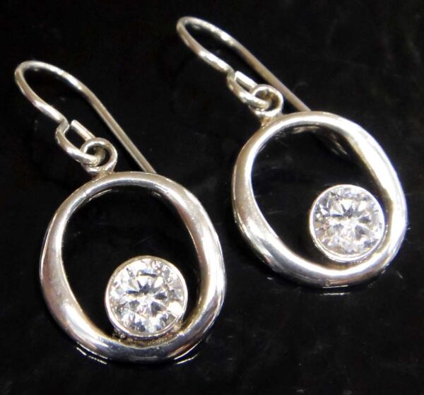 These white cubic zirconia and sterling silver earrings are handmade by Sonoma Art Works.