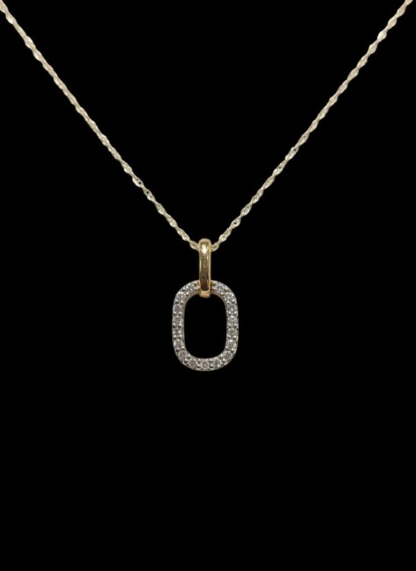 dainty diamond oval necklace on black background