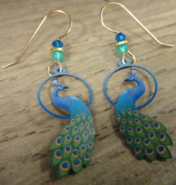 These green and blue peacock earrings are handmade by Sienna Sky.