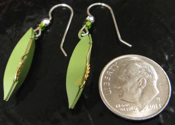 backside of pea pod earrings with dime to help gauge scale