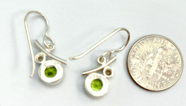 backside of peridot and pearl earrings with dime for size comparison