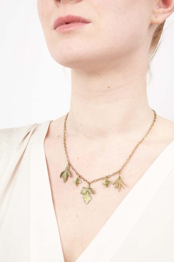 petite herb necklace on model