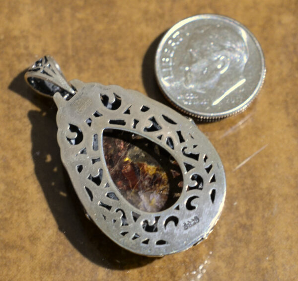 back of handmade pietersite and silverwork drop pendant with dime