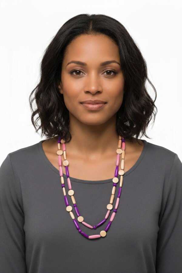 tan, pale pink, and purple tagua nut beaded necklace on woman