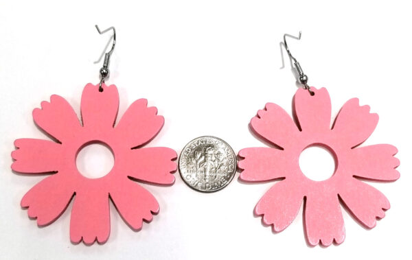 back of large pink flower earrings with dime for scale