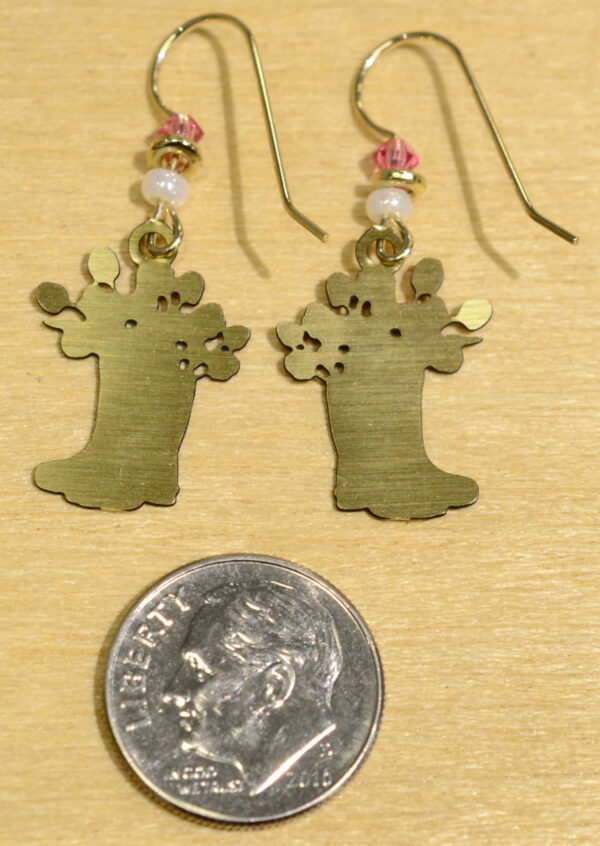 back of pink flowers in pink rain boots earrings with dime