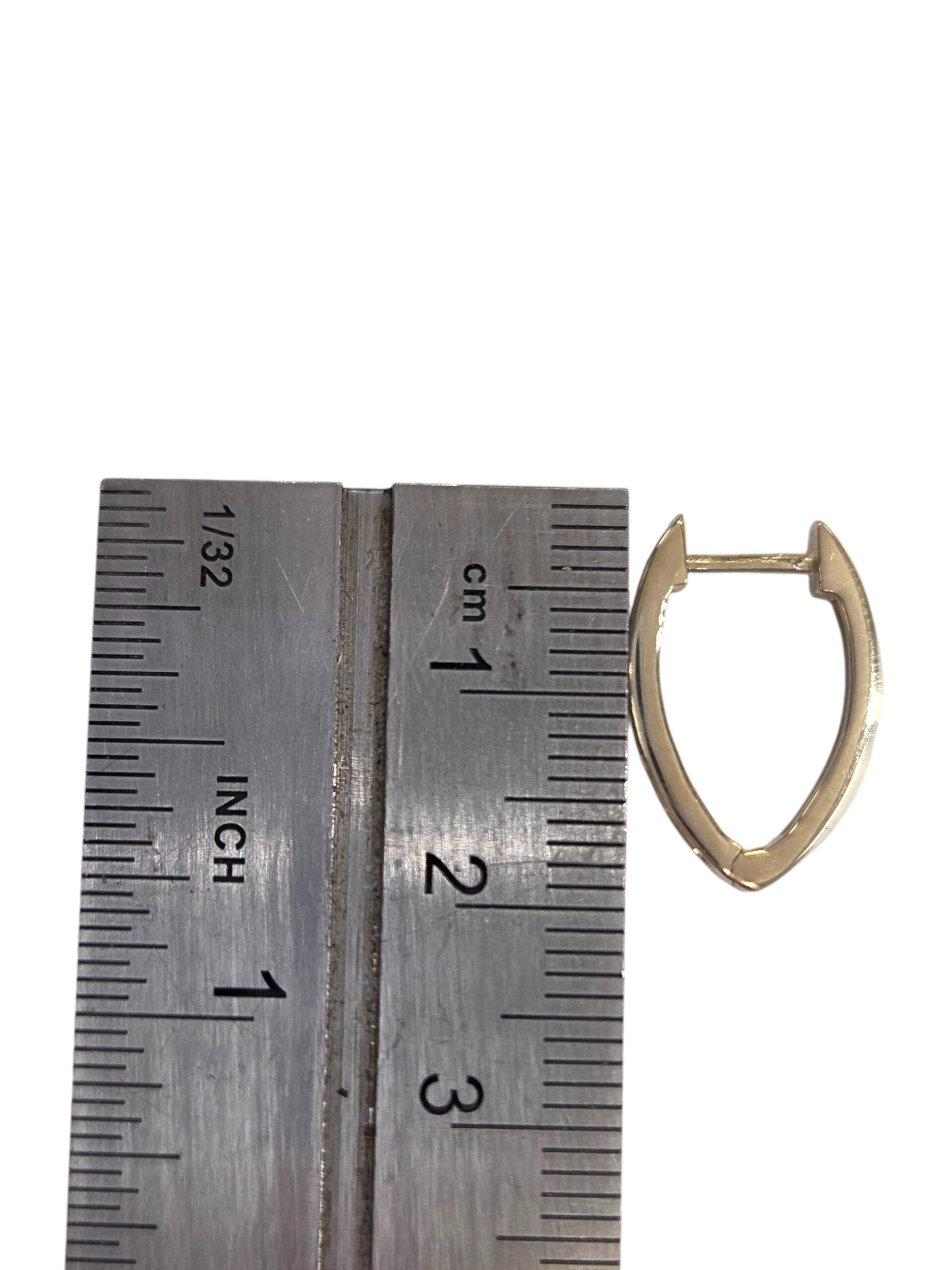 pointed hoop earrings with ruler