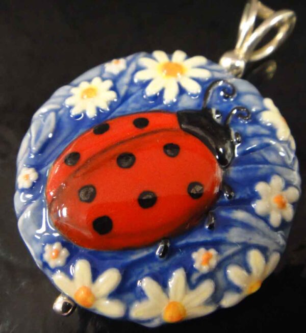 ladybug and daisy pendant