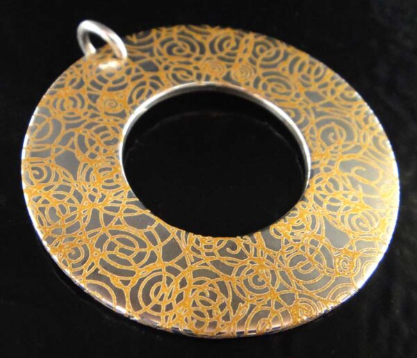 Handmade printed sterling silver circle pendant with swirls