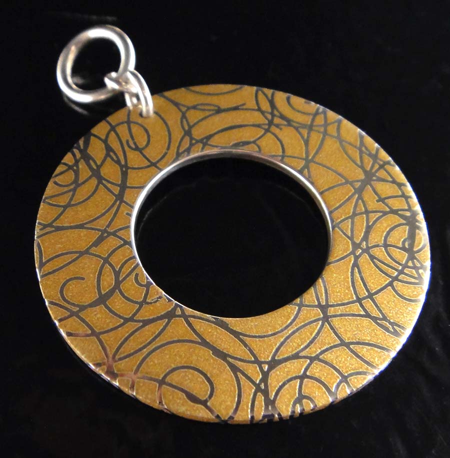 Handmade printed sterling silver pendant with swirls