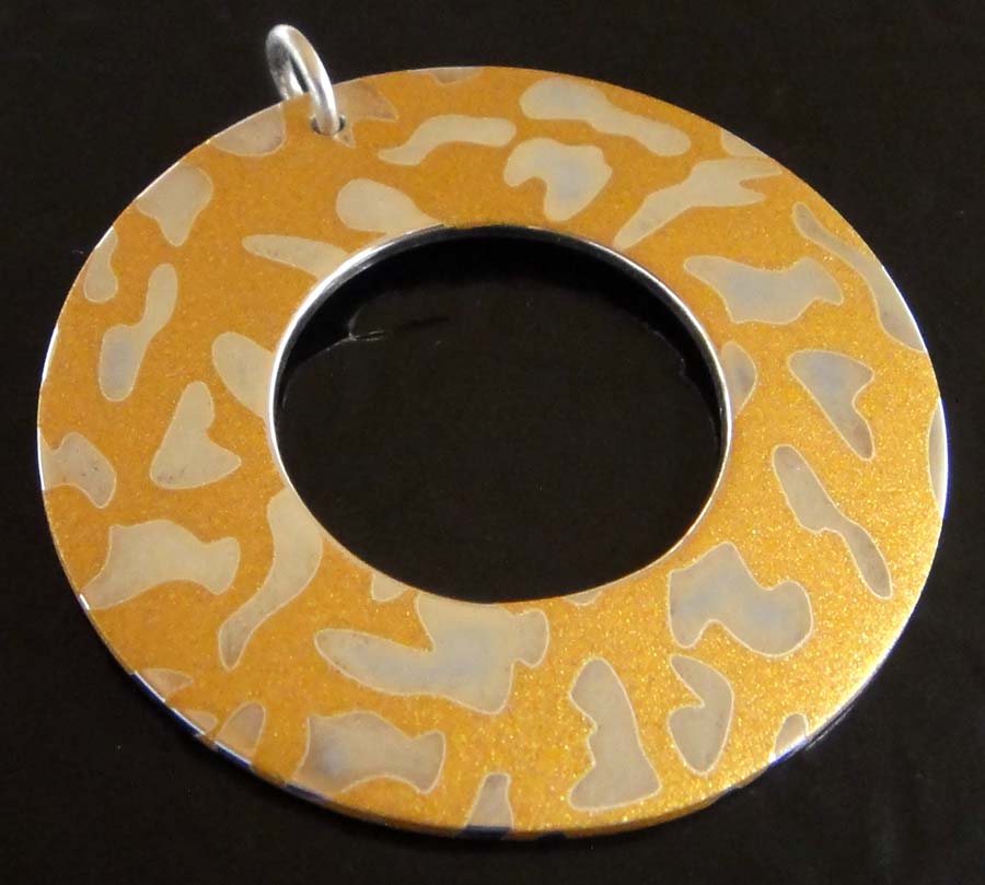 Handmade printed sterling silver pendant with animal spots