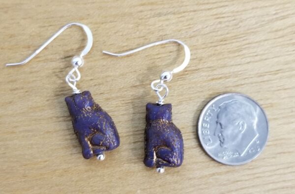 dark purple cat earrings with dime for scale