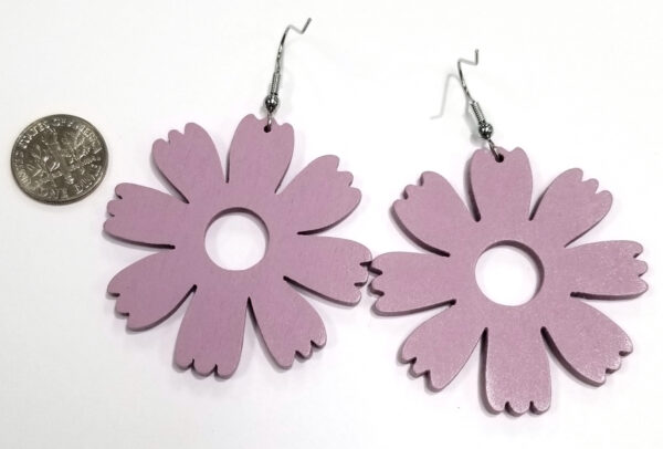 back of purple wooden flower earrings with dime