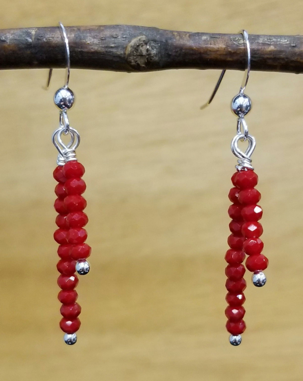 Red faceted tiny glass bead and sterling silver dangle earrings