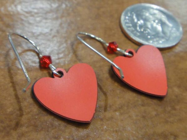 back of music notes and red heart earrings with dime