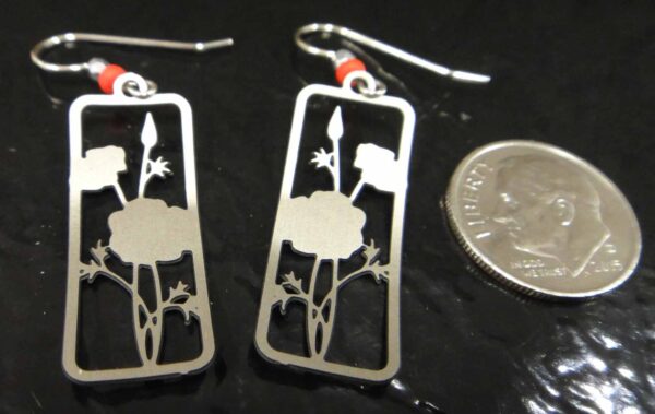 back of red poppy earrings with dime for scale
