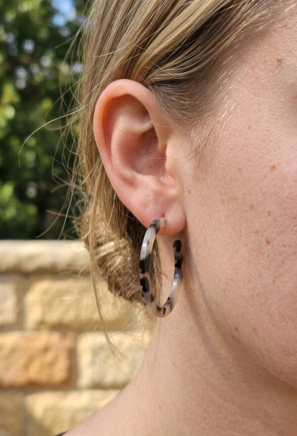 trendy brown hoop earrings on woman