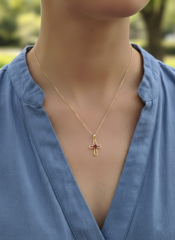 ruby cross necklace on model