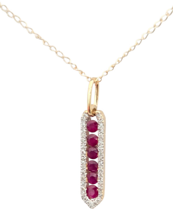 close-up of ruby, diamond and 14K gold necklace