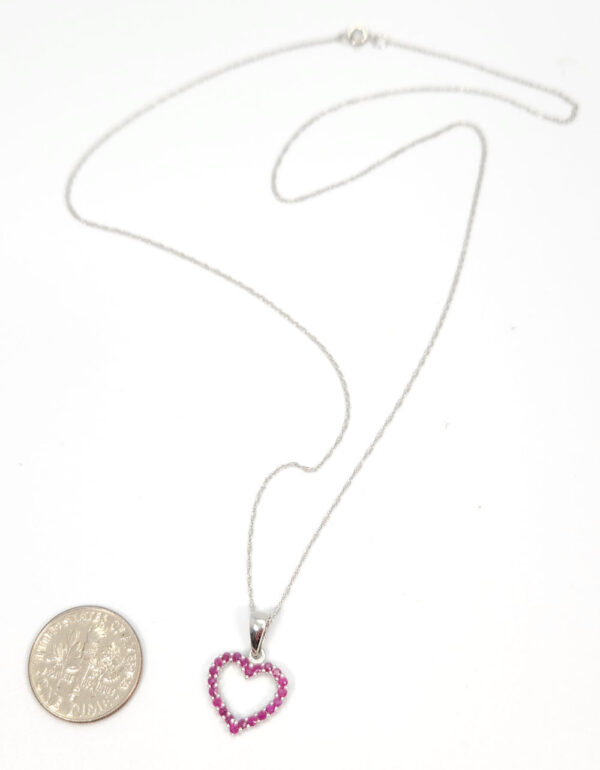 ruby heart necklace with dime for size comparison