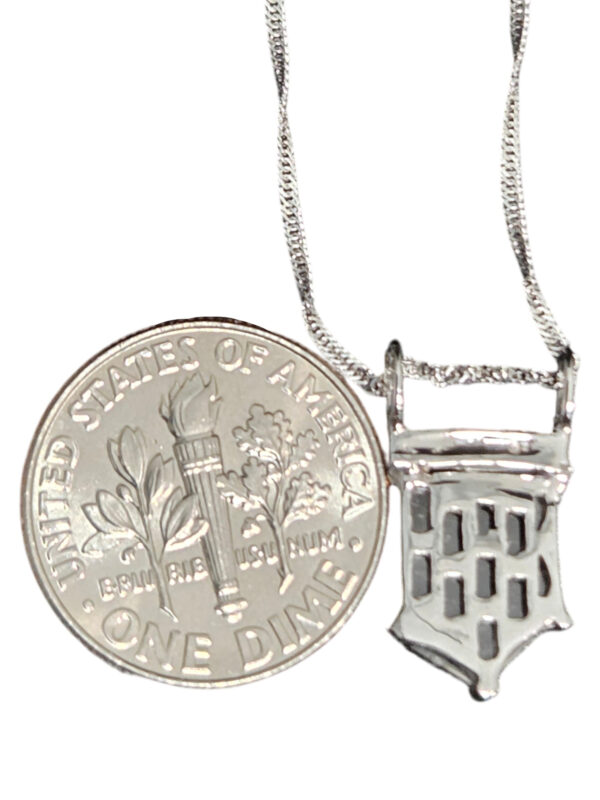 backside of salt and pepper diamond necklace with dime for size comparison
