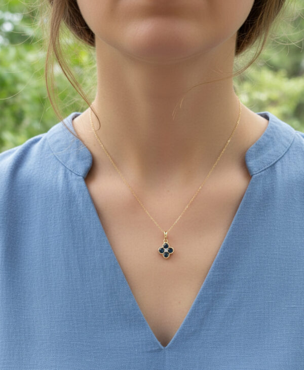 dainty diamond and 4 sapphire necklace on model