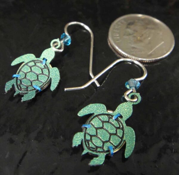 Back of sea turtle earrings made by Sienna Sky with dime for scale