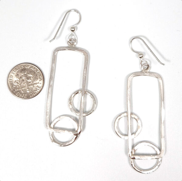 backside of earrings with dime for size comparison
