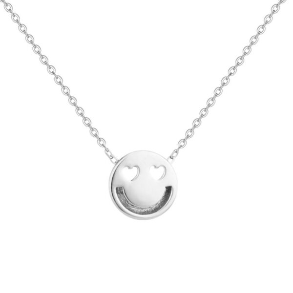 smiley face necklace with heart shaped eyes in sterling silver