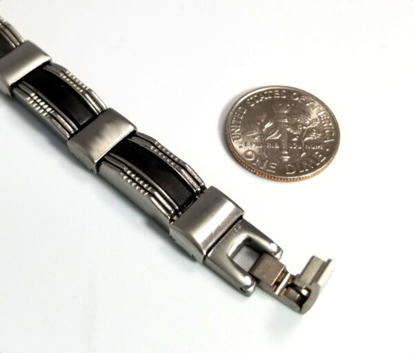 stainless steel bracelet close-up with dime to help you judge scale
