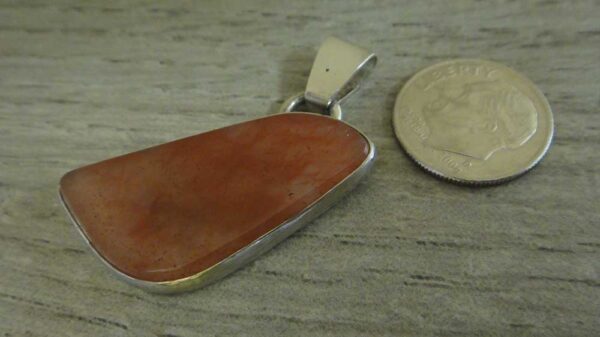 strawberry moss agate pendant with dime for size