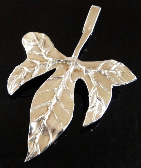 Stylized tropical leaf sterling silver pendant