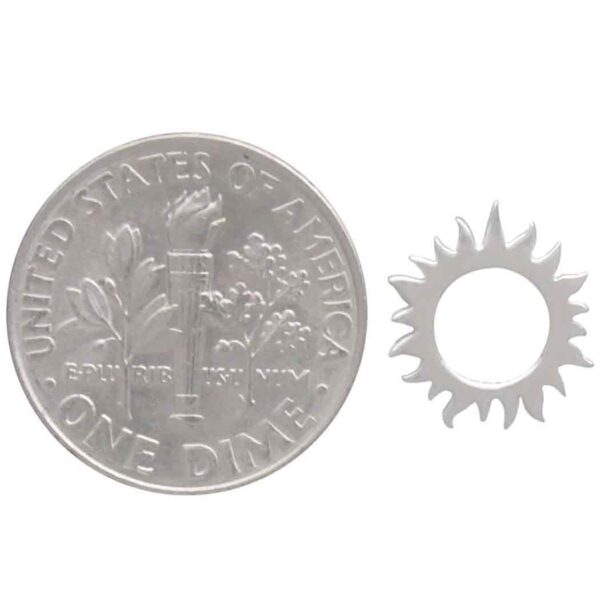 sun stud earring next to dime to show scale
