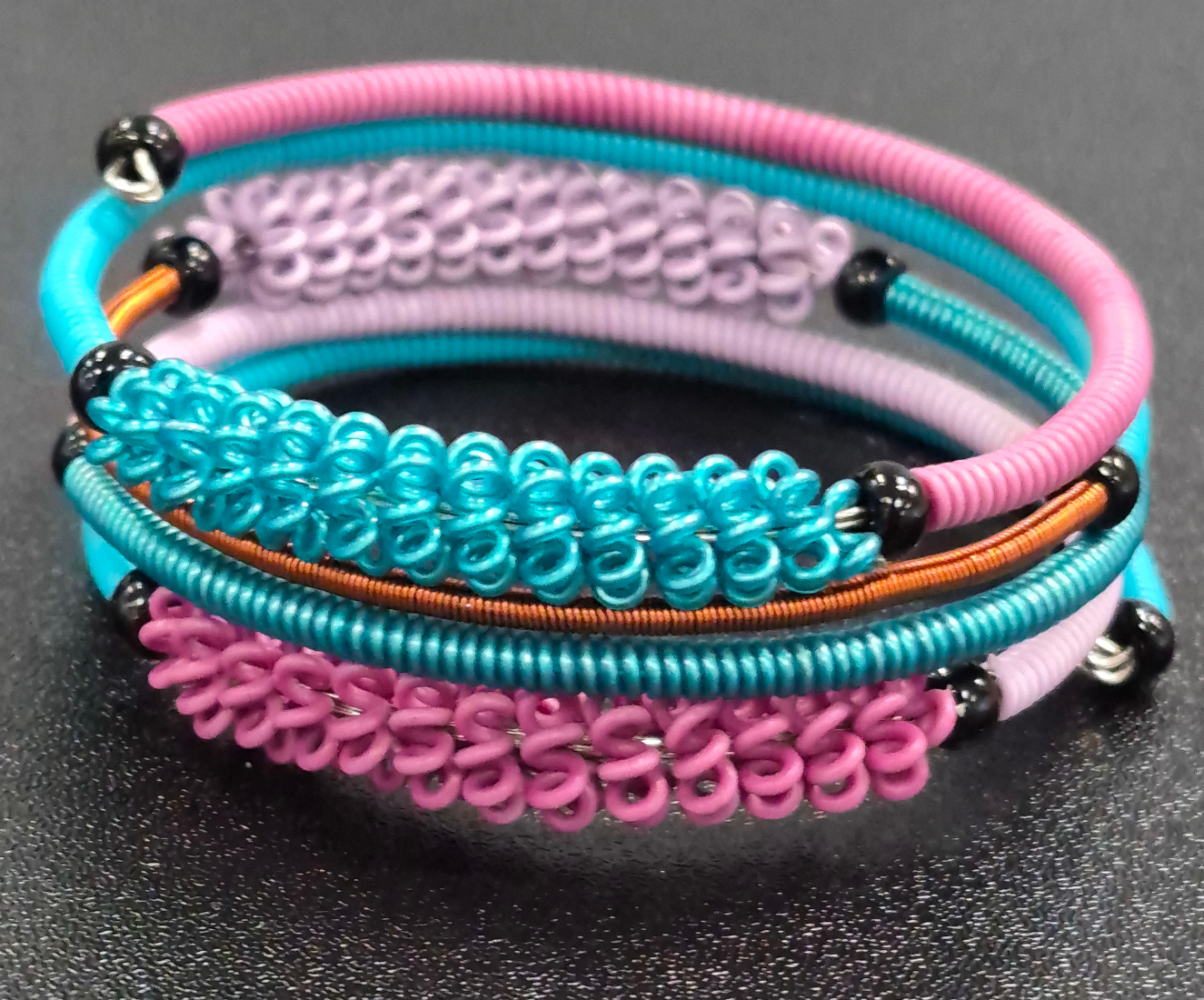 telephone wire bracelet in peacock color