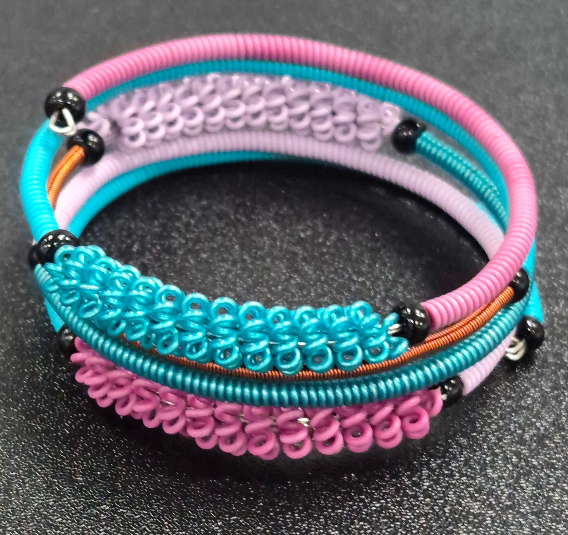 telephone wire bracelet in peacock color