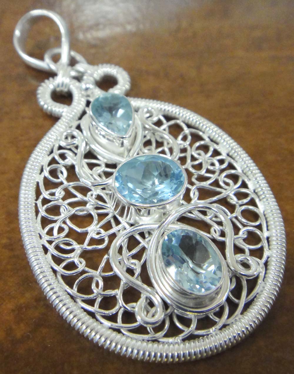 Blue topaz sterling silver wire wrapped pendant