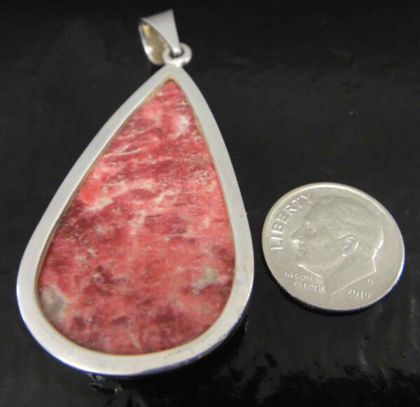 Rough thulite and sterling silver pendant back view
