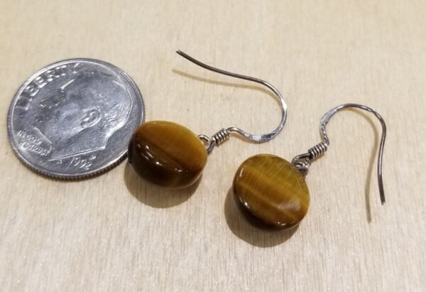 back of tiger's eye earrings with dime for scale
