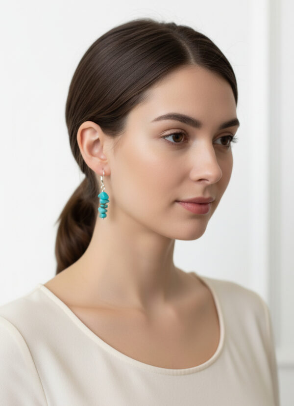 turquoise earrings on model