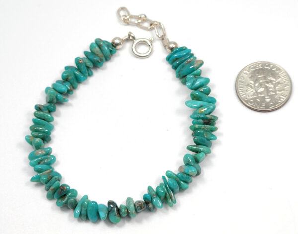 turquoise beaded bracelet with dime to help show size