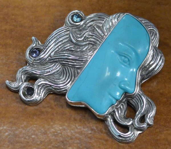 turquoise carved face and sterling silver handmade pendant