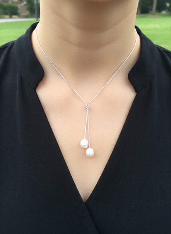 sterling silver and two pearl necklace on woman