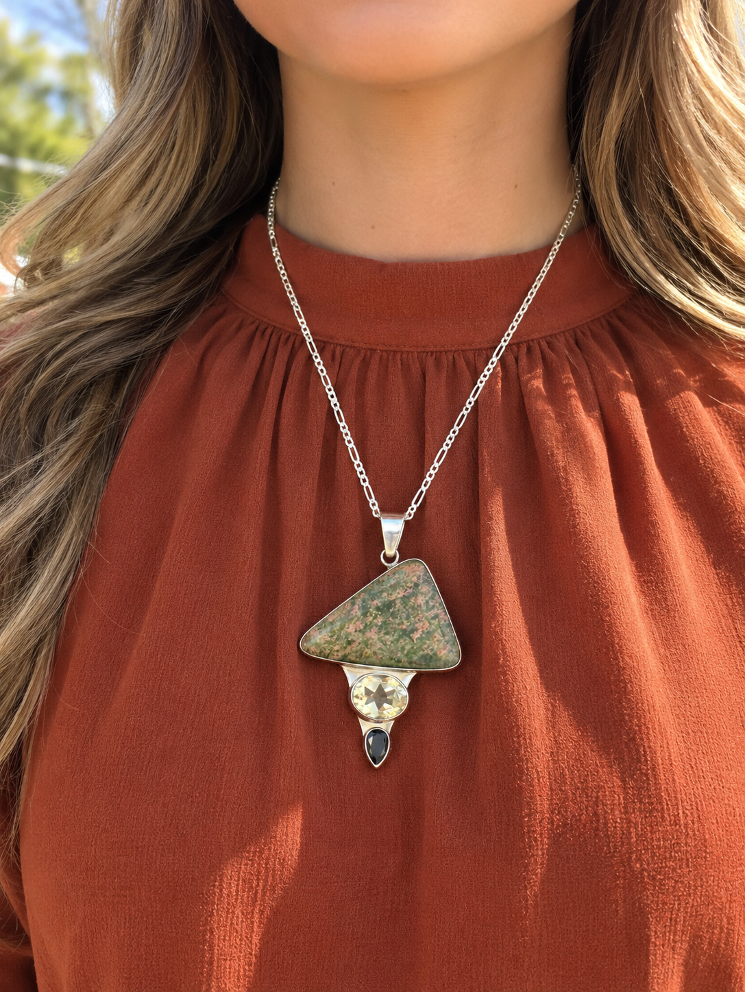 unakite, citrine, and garnet necklace on model