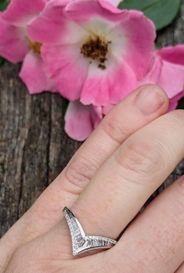 pointed ring on hand