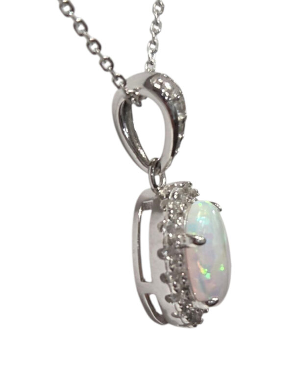 side view of white opal and cubic zirconia pendant