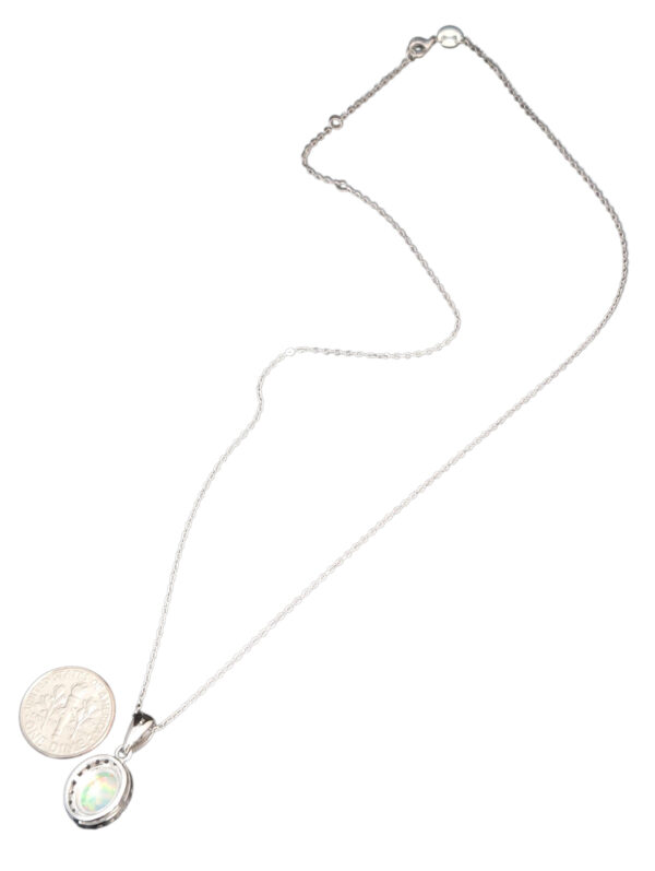 White opal necklace with dime for size comparison
