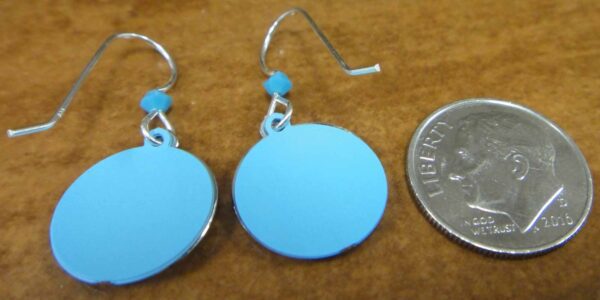 backside of peace earrings with dime for size comparison
