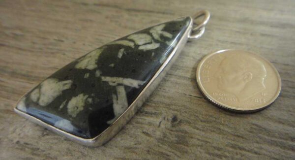 writing stone pendant with dime for size