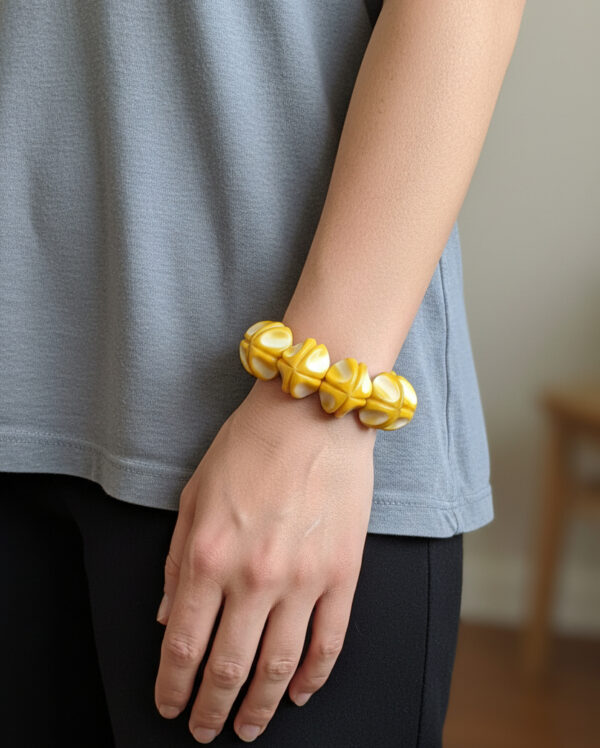 yellow tagua bracelet on model