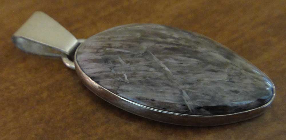 Handmade yuksporite and sterling silver pendant by Dale Repp in Lone Tree, Iowa